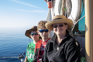 Mom, Kerstin Benoit and two sons on a lake michigan fishing charter 