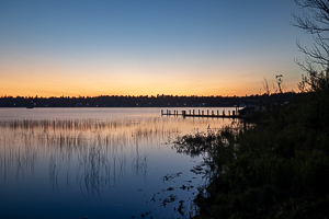 sun setting over boat dock on Paradise Bay beaver island